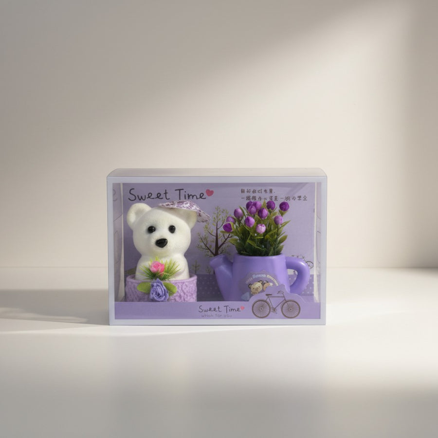 eRamis white teddy bear with purple and red floral decor in a watering can. Gift set.